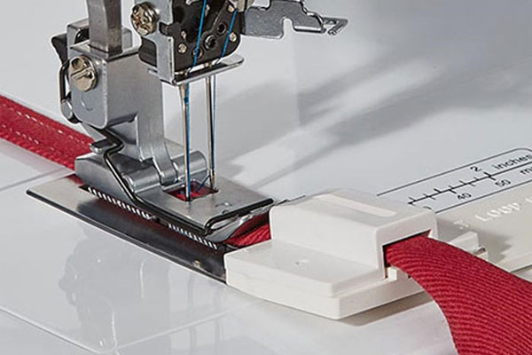 Appareil bretelles pour recouvreuse