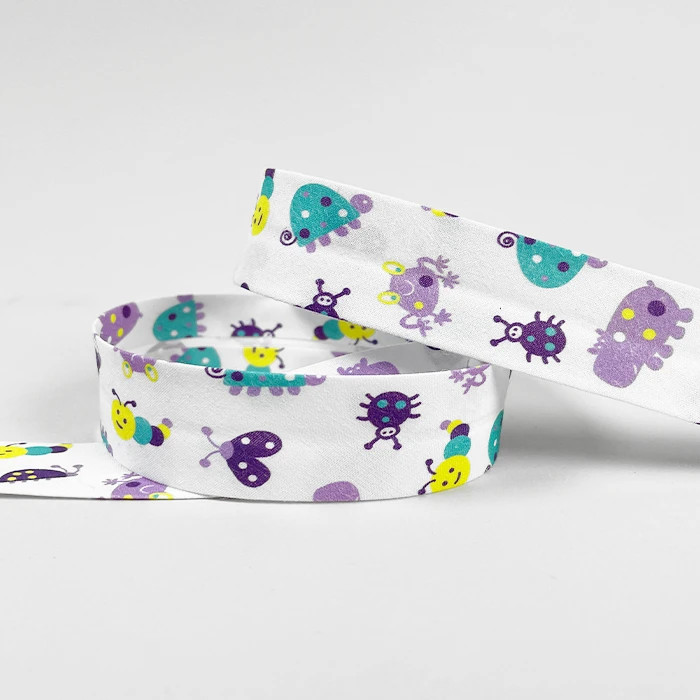 Biais replié 25mm blanc motif petites bêtes /m Biais replié 25mm blanc motif petites bêtes /m